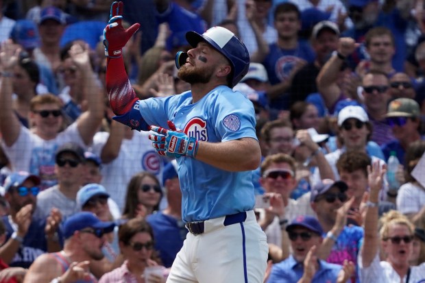 The Cubs' Michael Busch gestures after hitting his third home run of the day in the seventh inning against the Cardinals on Friday, July 4, 2025, at Wrigley Field. (AP Photo/David Banks)