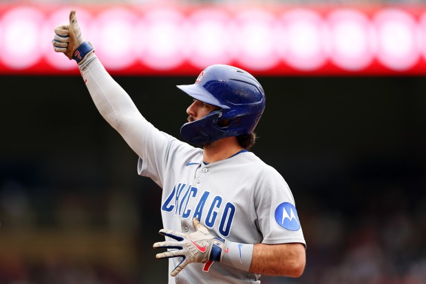Cubs shortstop Dansby Swanson celebrates his RBI single against the Twins in the fifth inning Thursday, July 10, 2025, in Minneapolis. (David Berding/Getty Images)