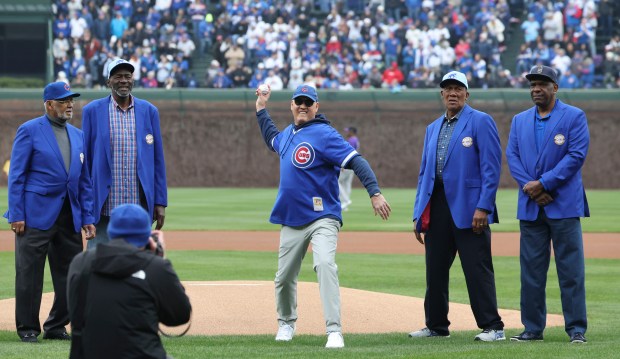 Ryne Sandberg, center, throws out a ceremonial first pitch with former Chicago Cubs Billy Williams, Lee Smith, Fergie Jenkins and Andre Dawson on April 1, 2024, in the home opener at Wrigley Field. (Brian Cassella/Chicago Tribune)