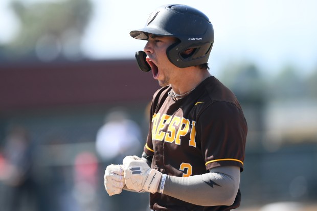 Crespi's Landon Hodge is fired up as he leads off the game with a base hit against Harvard-Westlake in their Mission League game May 2, 2025.(Photo by Andy Holzman, Contributing Photographer)