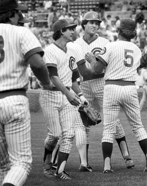 Larry Bowa, left, and Chicago Cubs coach Gordy MacKenzie [5] congratulate Ryne Sandberg, whose two-out single in the 13th inning gave the Cubs a 3-2 win over the Los Angeles Dodgers on May 29, 1982. (Dave Nystrom/Chicago Tribune)