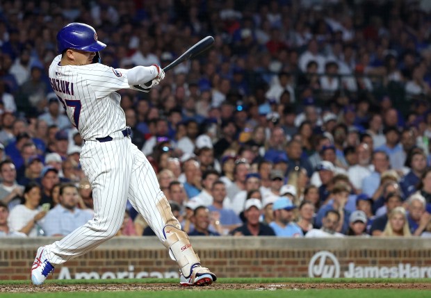 Chicago Cubs designated hitter Seiya Suzuki drives in two runs on a single in the fourth inning of a game against the Cleveland Guardians at Wrigley Field in Chicago on July 2, 2025. (Chris Sweda/Chicago Tribune)