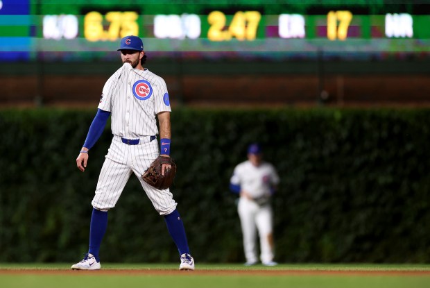 Chicago Cubs shortstop Dansby Swanson (7) holds his jersey in his mouth in the fifth inning of a game against the Cleveland Guardians at Wrigley Field in Chicago on July 2, 2025. (Chris Sweda/Chicago Tribune)
