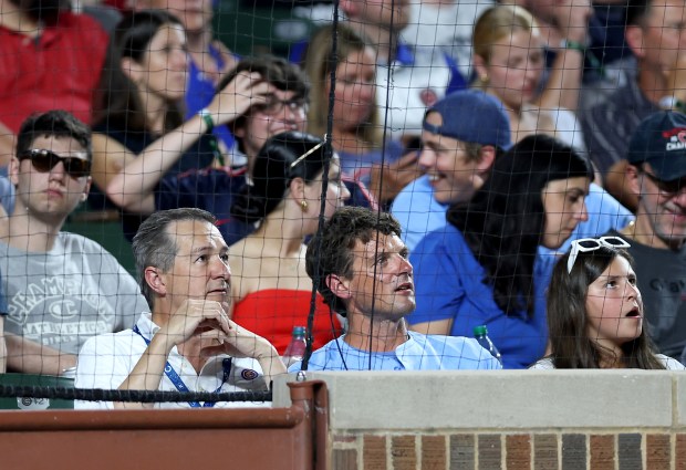 Chicago Cubs chairman Tom Ricketts (lower left) takes in a game between the Cubs and the Cleveland Guardians in the fifth inning at Wrigley Field in Chicago on July 2, 2025. (Chris Sweda/Chicago Tribune)