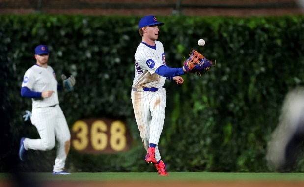 Chicago Cubs center fielder Pete Crow-Armstrong (4) bobbles a ball after making a catch in the sixth inning of a game against the Cleveland Guardians at Wrigley Field in Chicago on July 2, 2025. (Chris Sweda/Chicago Tribune)