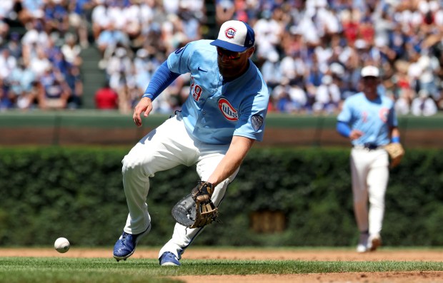 Cubs first baseman Michael Busch fields a ground ball in the third inning against the Red Sox on July 18, 2025, at Wrigley Field. (Chris Sweda/Chicago Tribune)