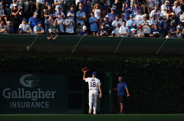 Chicago Cubs starting pitcher Matthew Boyd waves to the crowd in the bleachers as he heads out to the bullpen before his scheduled start against the Kansas City Royals at Wrigley Field in Chicago on July 22, 2025. (Chris Sweda/Chicago Tribune)