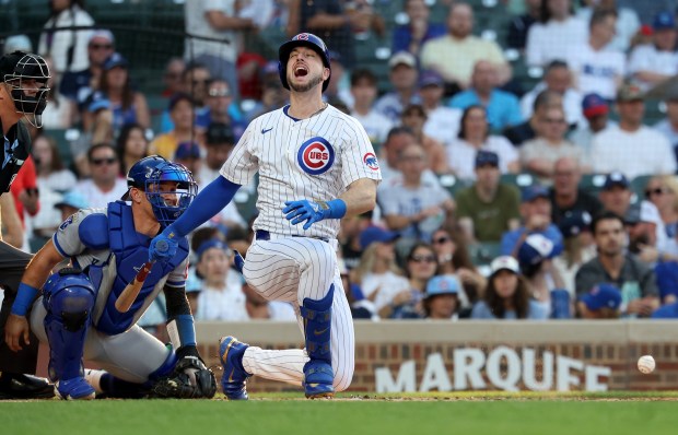 Chicago Cubs left fielder Kyle Tucker screams in pain after fouling a ball off of himself during an at-bat in the first inning of a game against the Kansas City Royals at Wrigley Field in Chicago on July 22, 2025. (Chris Sweda/Chicago Tribune)