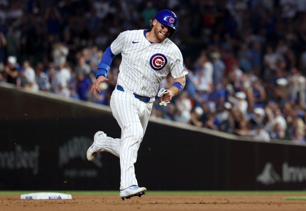 Chicago Cubs catcher Carson Kelly rounds the bases en route to scoring on a double by teammate Pete Crow-Armstrong in the fifth inning of a game against the Kansas City Royals at Wrigley Field in Chicago on July 22, 2025. Crow-Armstrong was tagged out at third base trying to stretch his double into a triple to end the inning. (Chris Sweda/Chicago Tribune)