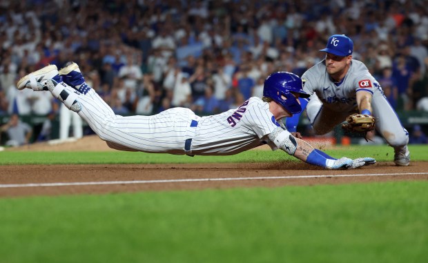 Chicago Cubs center fielder Pete Crow-Armstrong slides into third base as he is tagged out by Kansas City Royals third baseman Nick Loftin as Crow-Armstrong tried to stretch his run-scoring double into a triple in the fifth inning of a game at Wrigley Field in Chicago on July 22, 2025. (Chris Sweda/Chicago Tribune)