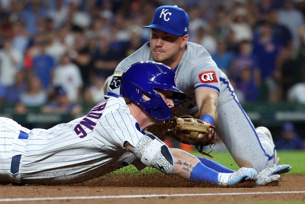 Chicago Cubs center fielder Pete Crow-Armstrong slides into third base as he is tagged out by Kansas City Royals third baseman Nick Loftin as Crow-Armstrong tried to stretch his run-scoring double into a triple in the fifth inning of a game at Wrigley Field in Chicago on July 22, 2025. (Chris Sweda/Chicago Tribune)