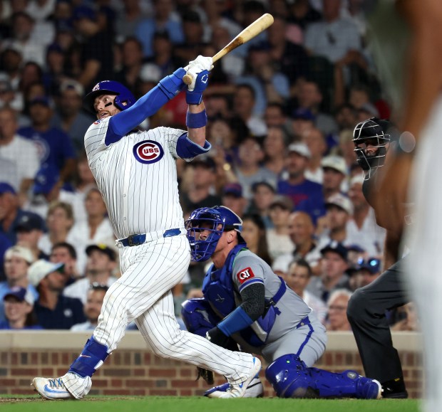 Chicago Cubs catcher Carson Kelly drives in a run on a sacrifice fly in the seventh inning of a game against the Kansas City Royals at Wrigley Field in Chicago on July 22, 2025. (Chris Sweda/Chicago Tribune)