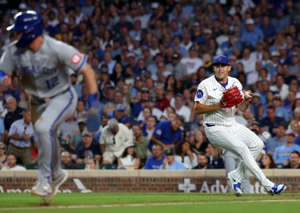 Chicago Cubs starting pitcher Matthew Boyd scans the infield after fielding a ball that went for a bunt single for Kansas City Royals left fielder John Rave in the fifth inning of a game at Wrigley Field in Chicago on July 22, 2025. (Chris Sweda/Chicago Tribune)