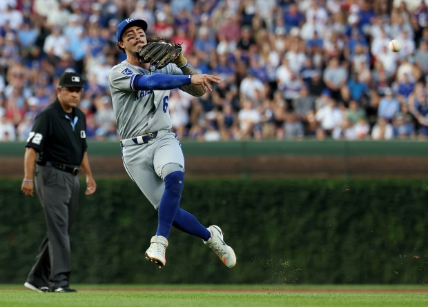 Kansas City Royals second baseman Jonathan India throws late to first base on a run-scoring single for Chicago Cubs third baseman Matt Shaw in the second inning of a game at Wrigley Field in Chicago on July 22, 2025. (Chris Sweda/Chicago Tribune)