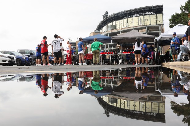 Tailgaters gather in a parking lot before a White Sox-Cubs game on July 25, 2025, at Rate Field. (John J. Kim/Chicago Tribune)
