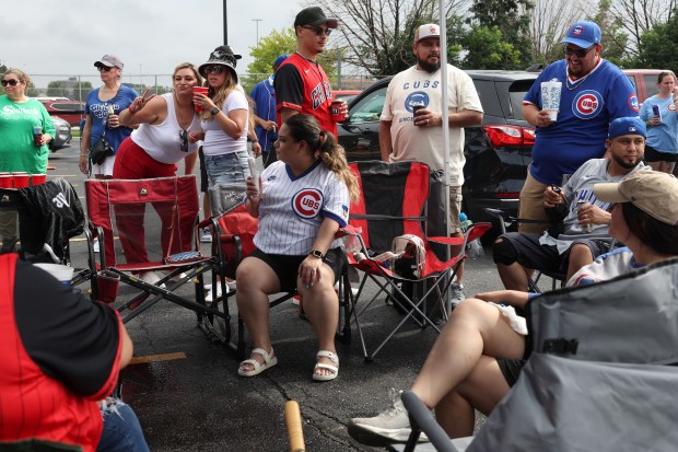 Tailgaters gather in a parking lot before a White Sox-Cubs game on July 25, 2025, at Rate Field. (John J. Kim/Chicago Tribune)
