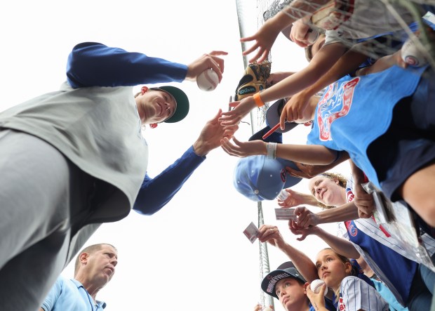 Cubs pitcher Ben Brown signs autographs before a game against the White Sox on July 25, 2025, at Rate Field. (John J. Kim/Chicago Tribune)