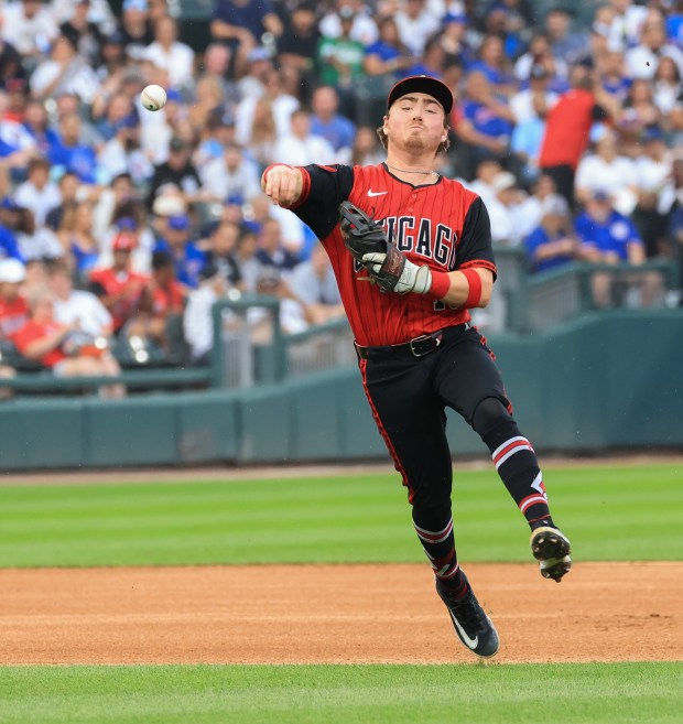 White Sox shortstop Chase Meidroth throws to first on a grounder from Cubs third baseman Vidal Bruján in the third inning on July 25, 2025, at Rate Field. (John J. Kim/Chicago Tribune)