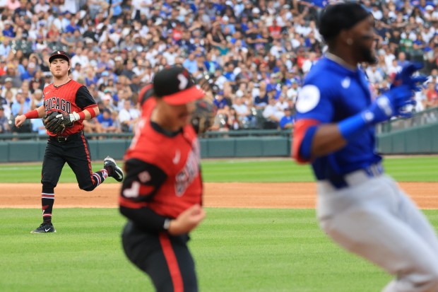 White Sox shortstop Chase Meidroth, left, watches after throwing to first on a grounder from Cubs third baseman Vidal Bruján, right, in the third inning on July 25, 2025, at Rate Field. (John J. Kim/Chicago Tribune)
