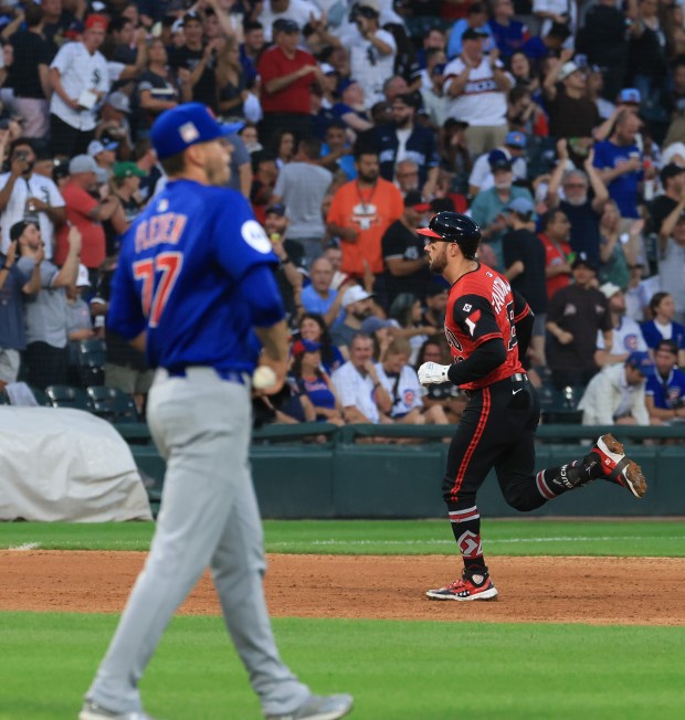 White Sox right fielder Mike Tauchman rounds the bases after hitting a two-run home run off Cubs reliever Chris Flexen, left, in the fourth inning on July 25, 2025, at Rate Field. (John J. Kim/Chicago Tribune)
