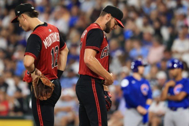 White Sox starter Adrian Houser, center, finishes a meeting on the mound while throwing against the Cubs in the seventh inning on July 25, 2025, at Rate Field. (John J. Kim/Chicago Tribune)