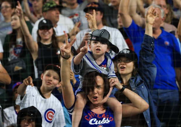 A child wears a rally cap during the seventh-inning stretch of a White Sox-Cubs game on July 25, 2025, at Rate Field. (John J. Kim/Chicago Tribune)