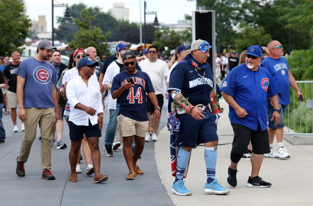 Cubs fans arrive at Rate Field before a game against the White Sox on July 26, 2025. (Chris Sweda/Chicago Tribune)