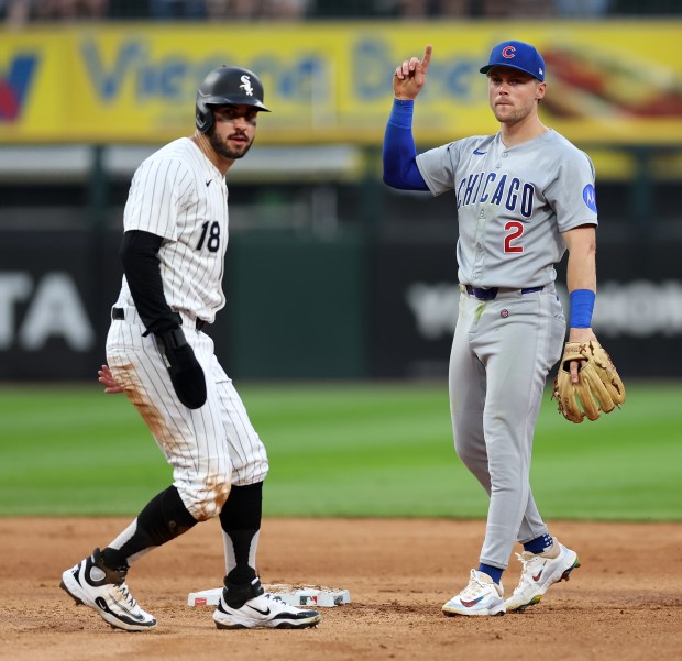 Cubs second baseman Nico Hoerner, right, celebrates after completing a double play following a forceout of White Sox right fielder Mike Tauchman at second in the sixth inning on July 26, 2025, at Rate Field. (Chris Sweda/Chicago Tribune)