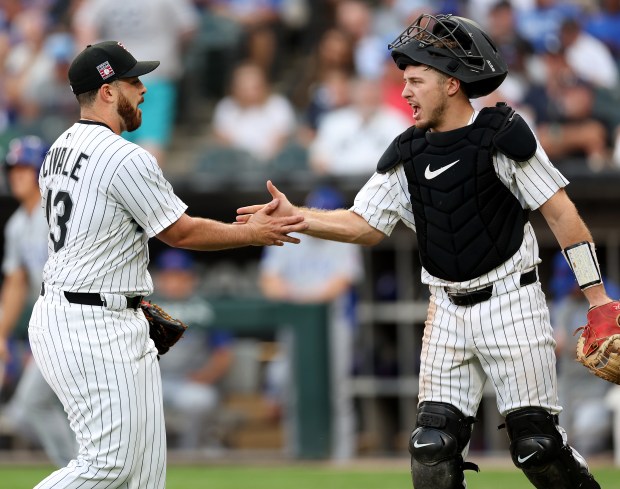 White Sox starter Aaron Civale and catcher Kyle Teel slap hands after retiring the Cubs in the second inning on July 26, 2025, at Rate Field. (Chris Sweda/Chicago Tribune)