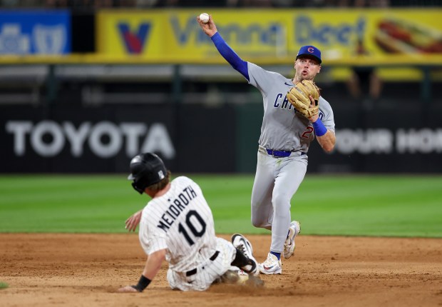 Cubs second baseman Nico Hoerner throws to first base to complete a double play after forcing out White Sox shortstop Chase Meidroth at second on the last play of the game on July 26, 2025, at Rate Field. The Cubs won 6-1. (Chris Sweda/Chicago Tribune)