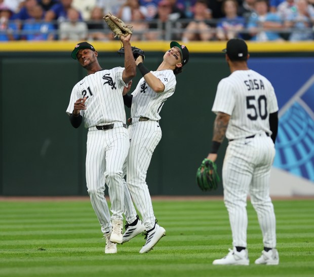 White Sox left fielder Michael A. Taylor, left, and center fielder Brooks Baldwin collide as Taylor makes a catch of a fly ball in the sixth inning against the Cubs on July 26, 2025,at Rate Field. (Chris Sweda/Chicago Tribune)