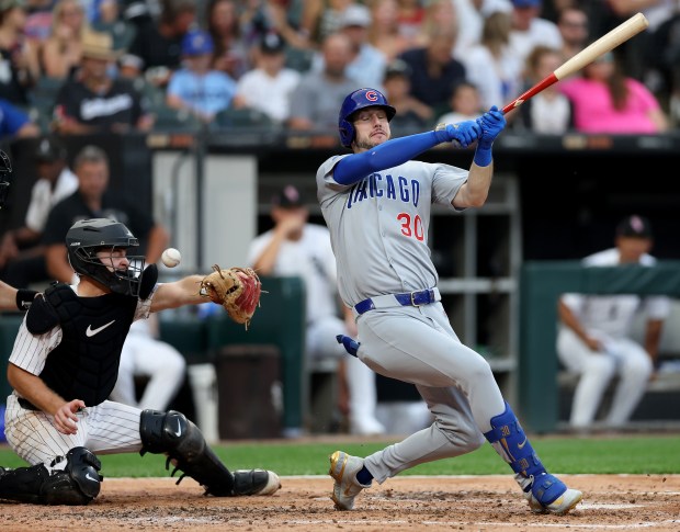 White Sox catcher Kyle Teel has a ball hit his face mask on a swing by Cubs right felder Kyle Tucker in the sixth inning on July 26, 2025, at Rate Field. (Chris Sweda/Chicago Tribune)