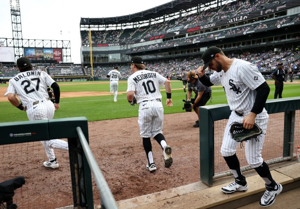 White Sox players Brooks Baldwin (27), Miguel Vargas (20), Chase Meidroth (10) and Mike Tauchman take the field for a game against the Cubs on July 26, 2025, at Rate Field. (Chris Sweda/Chicago Tribune)
