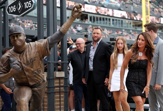 White Sox great Mark Buehrle stands with family at the new bronze statue of him unveiled at Rate Field in Chicago, July 11, 2025. (Chris Sweda/Chicago Tribune)
