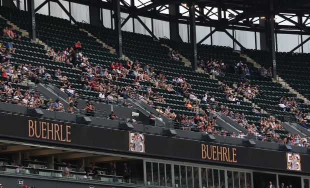 Fans in the upper deck look on during a ceremony to unveil a new bronze statue of Chicago White Sox great Mark Buehrle at Rate Field in Chicago before game two of a doubleheader between the Sox and the Cleveland Guardians on July 11, 2025. (Chris Sweda/Chicago Tribune)