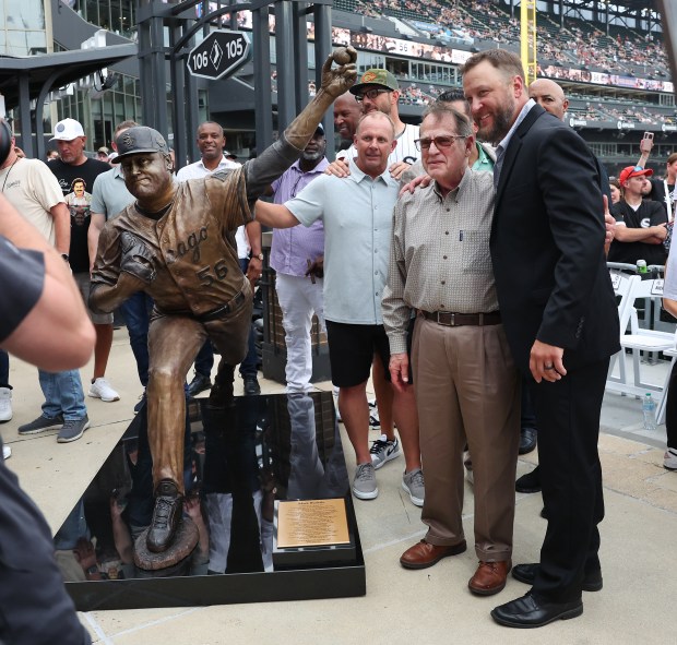 Chicago White Sox great Mark Buehrle and Sox chairman Jerry Reinsdorf pose beside a new bronze statue of Buehrle that was unveiled along the right field concourse at Rate Field in Chicago before game two of a doubleheader between the Sox and the Cleveland Guardians on July 11, 2025. (Chris Sweda/Chicago Tribune)