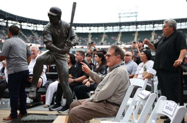 Chicago White Sox chairman Jerry Reinsdorf sits beside a statue of Harold Baines as he attends a ceremony to unveil a new bronze statue of Chicago White Sox great Mark Buehrle along the right field concourse at Rate Field in Chicago before game two of a doubleheader between the Sox and the Cleveland Guardians on July 11, 2025. (Chris Sweda/Chicago Tribune)