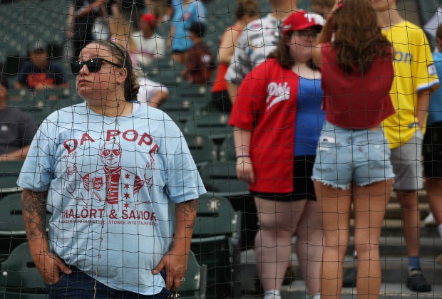 Amanda Rutkowski, of Lombard, wears a T-shirt that reads, "Da Pope" as rain begins before a White Sox-Phillies game at Rate Field on July 30, 2025, in Chicago. (John J. Kim/Chicago Tribune)