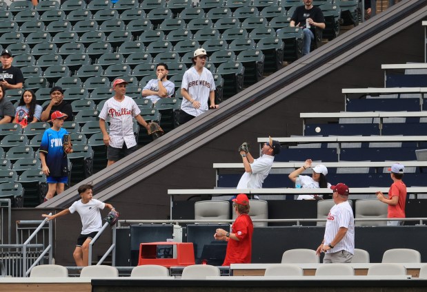 A home run ball hit by White Sox designated hitter Kyle Teel flies past fans in the second inning against the Phillies at Rate Field on July 30, 2025, in Chicago. (John J. Kim/Chicago Tribune)