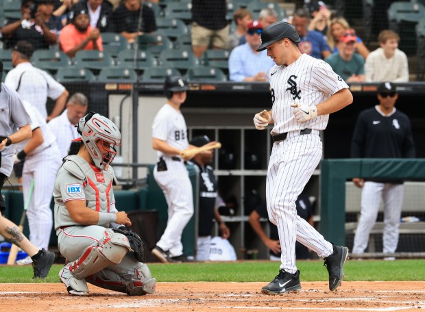 White Sox designated hitter Kyle Teel, right, crosses the plate after hitting a home run in the second inning against the Phillies at Rate Field on July 30, 2025, in Chicago. (John J. Kim/Chicago Tribune)