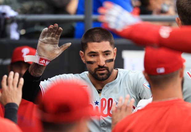 Phillies right fielder Nick Castellanos is congratulated after scoring on an RBI single from third baseman Otto Kemp in the fourth inning against the White Sox at Rate Field on July 30, 2025, in Chicago. (John J. Kim/Chicago Tribune)