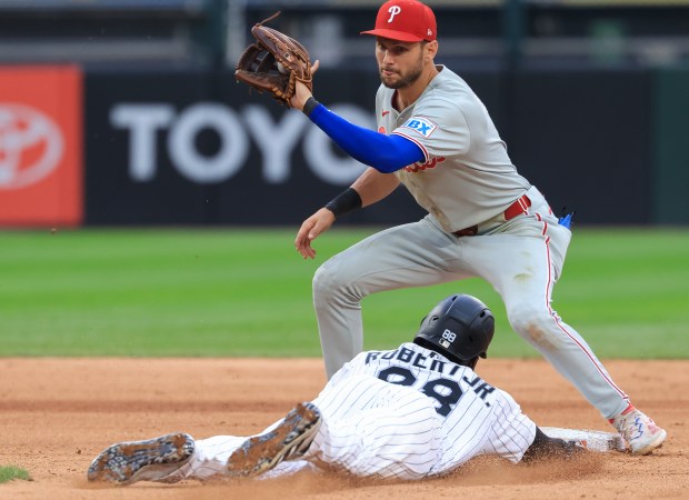 White Sox center fielder Luis Robert Jr. beats the tag from Phillies shortstop Trea Turner to steal second base in the sixth inning at Rate Field on July 30, 2025, in Chicago. (John J. Kim/Chicago Tribune)