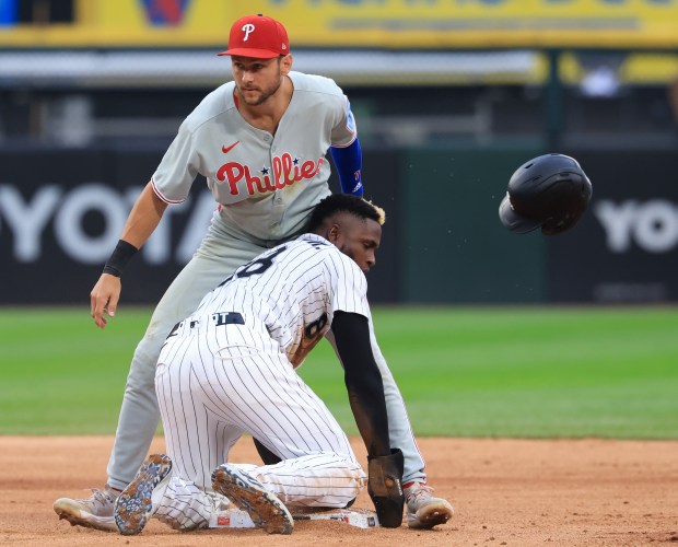White Sox center fielder Luis Robert Jr. beats the tag from Phillies shortstop Trea Turner to steal second base in the sixth inning at Rate Field on July 30, 2025, in Chicago. (John J. Kim/Chicago Tribune)