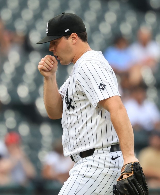White Sox pitcher Mike Vasil blows into his hand between batters in the seventh inning against the Phillies at Rate Field on July 30, 2025, in Chicago. (John J. Kim/Chicago Tribune)