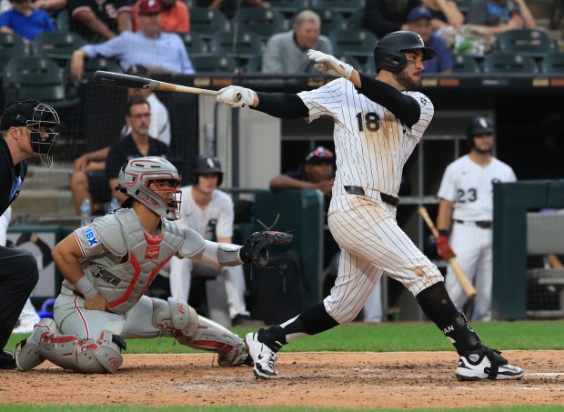 White Sox right fielder Mike Tauchman swings through on a single against the Phillies in the seventh inning at Rate Field on July 30, 2025, in Chicago. (John J. Kim/Chicago Tribune)