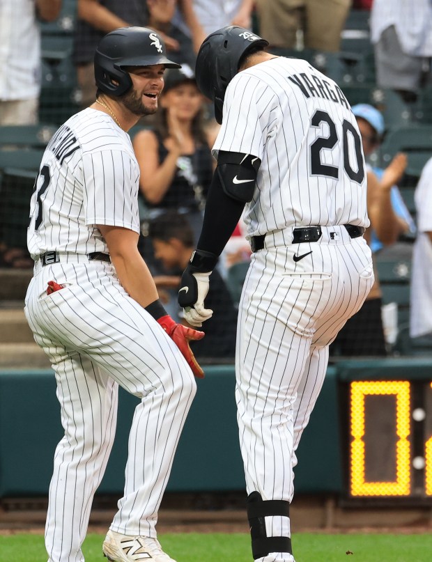 White Sox first baseman Miguel Vargas celebrates with left fielder Andrew Benintendi after hitting a three-run home run in the seventh inning against the Phillies at Rate Field on July 30, 2025, in Chicago. (John J. Kim/Chicago Tribune)