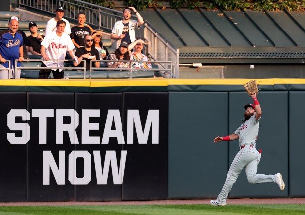 Philadelphia Phillies center fielder Brandon Marsh makes a running catch of a deep fly ball hit by Chicago White Sox right fielder Austin Slater in the first inning of a game at Rate Field in Chicago on July 29, 2025. (Chris Sweda/Chicago Tribune)