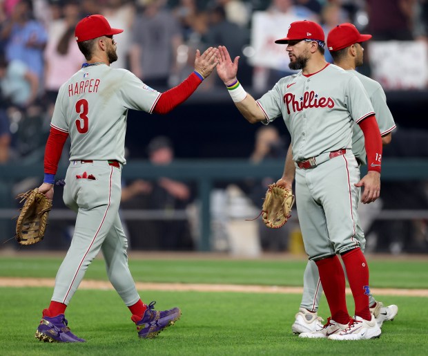Philadelphia Phillies players Bryce Harper (3) and Kyle Schwarber celebrate after a victory over the Chicago White Sox at Rate Field in Chicago on July 29, 2025. (Chris Sweda/Chicago Tribune)