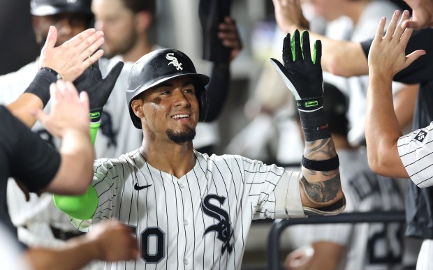 Chicago White Sox second baseman Lenyn Sosa is congratulated by his teammates in the dugout after hitting a two-run home run in the ninth inning of a game against the Philadelphia Phillies at Rate Field in Chicago on July 29, 2025. (Chris Sweda/Chicago Tribune)