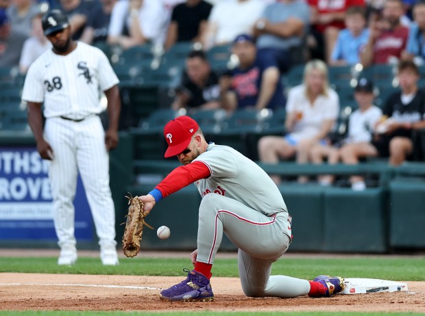 Philadelphia Phillies first baseman Bryce Harper is unable to field a ball in the dirt in the first inning of a game against the Chicago White Sox at Rate Field in Chicago on July 29, 2025. (Chris Sweda/Chicago Tribune)